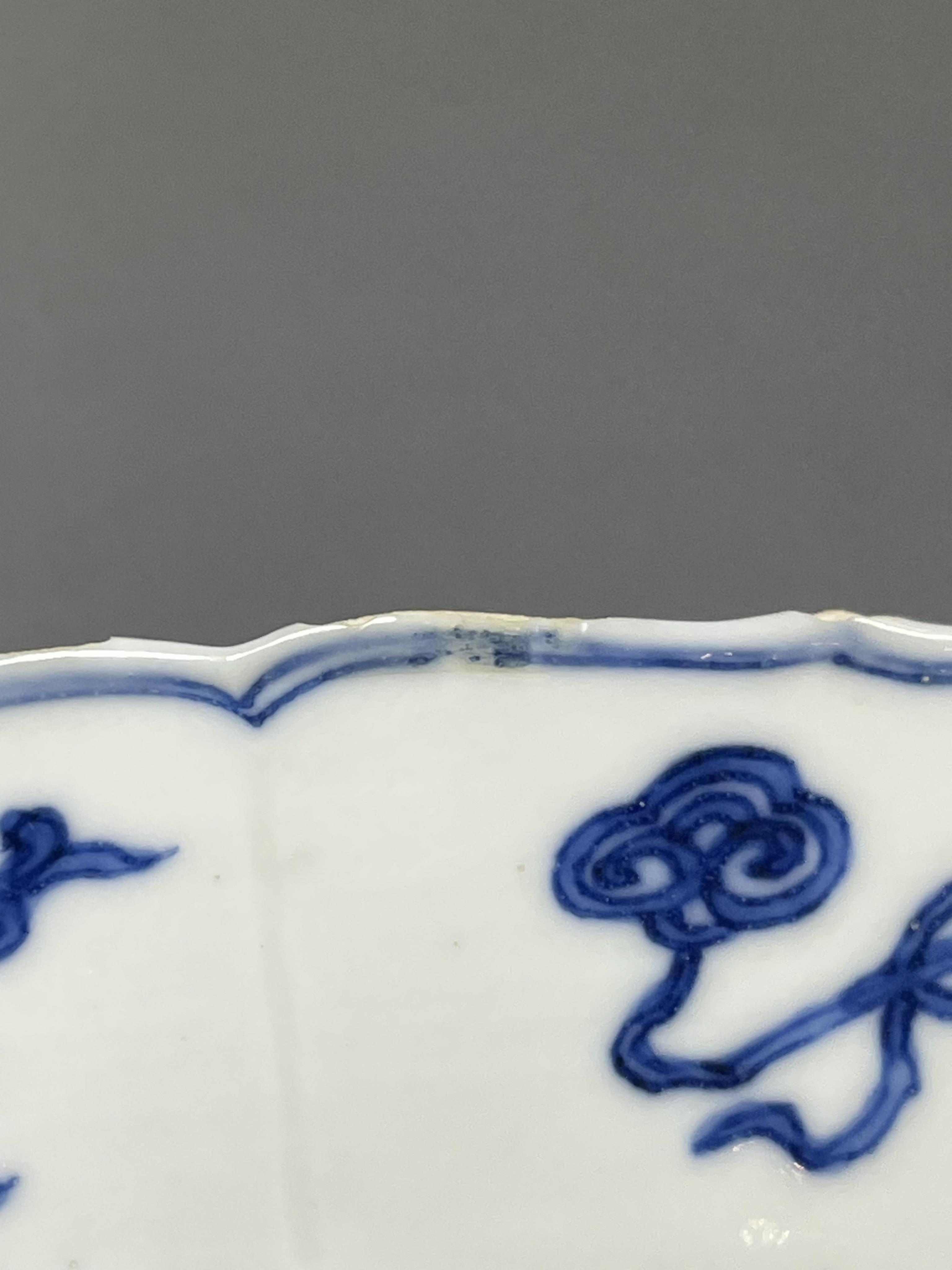A Chinese blue and white ‘ladies and phoenix’ dish, Kangxi period